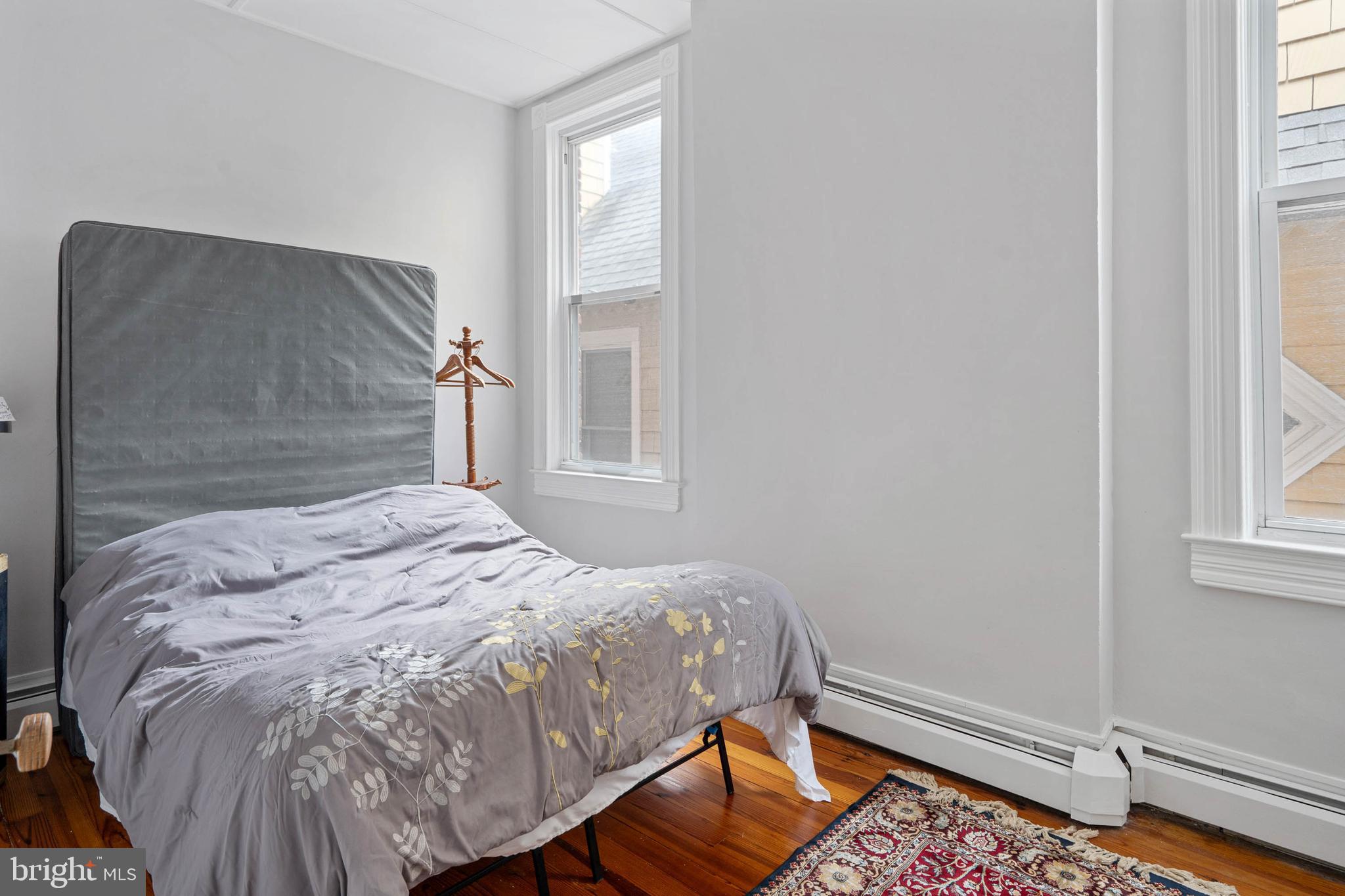 407 Savannah Road Lewes, DE 19958 - Photo 20 of 28 a bedroom with a bed and a window