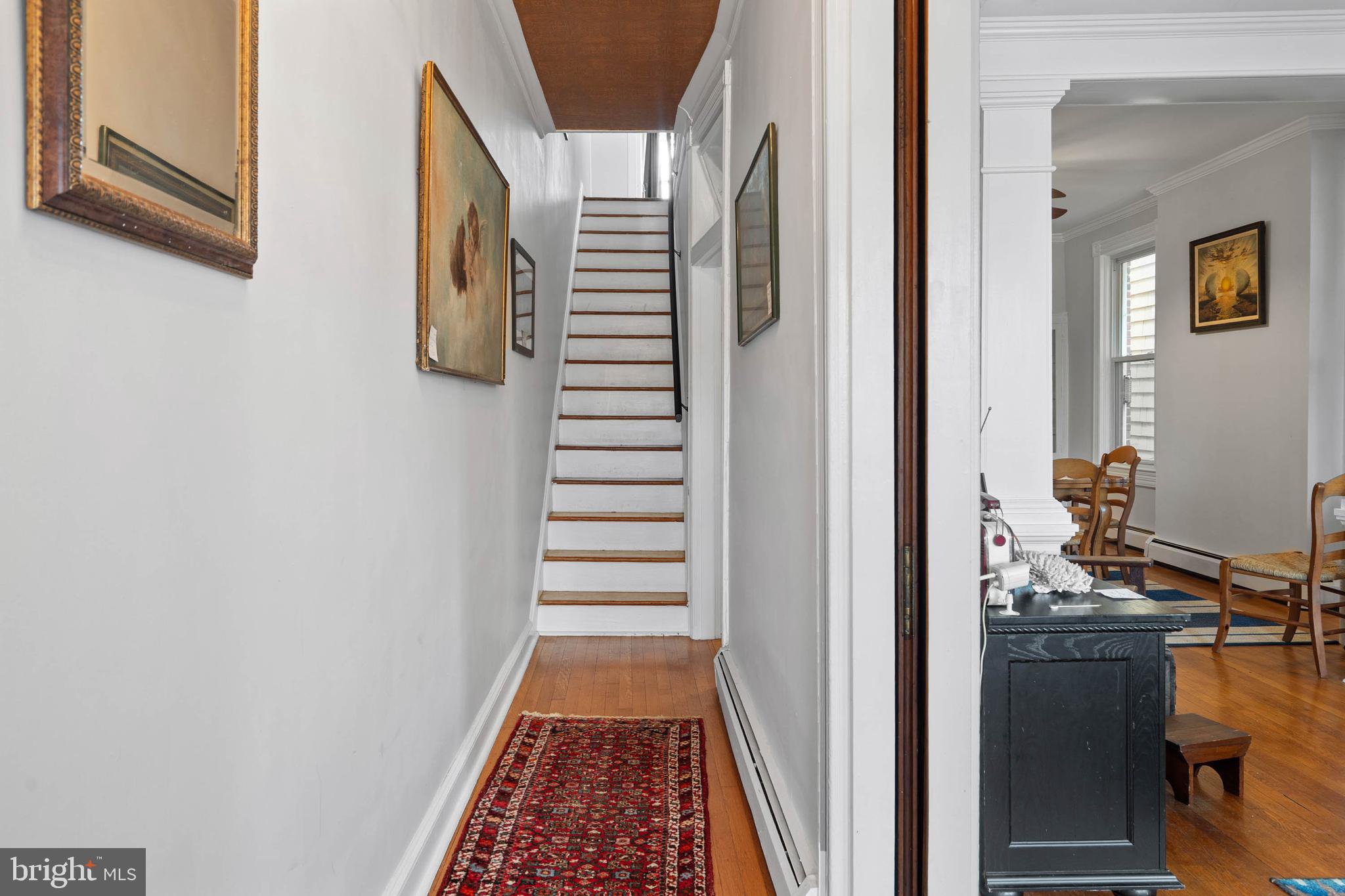 407 Savannah Road Lewes, DE 19958 - Photo 2 of 28 a view of a hallway with wooden floor and entryway