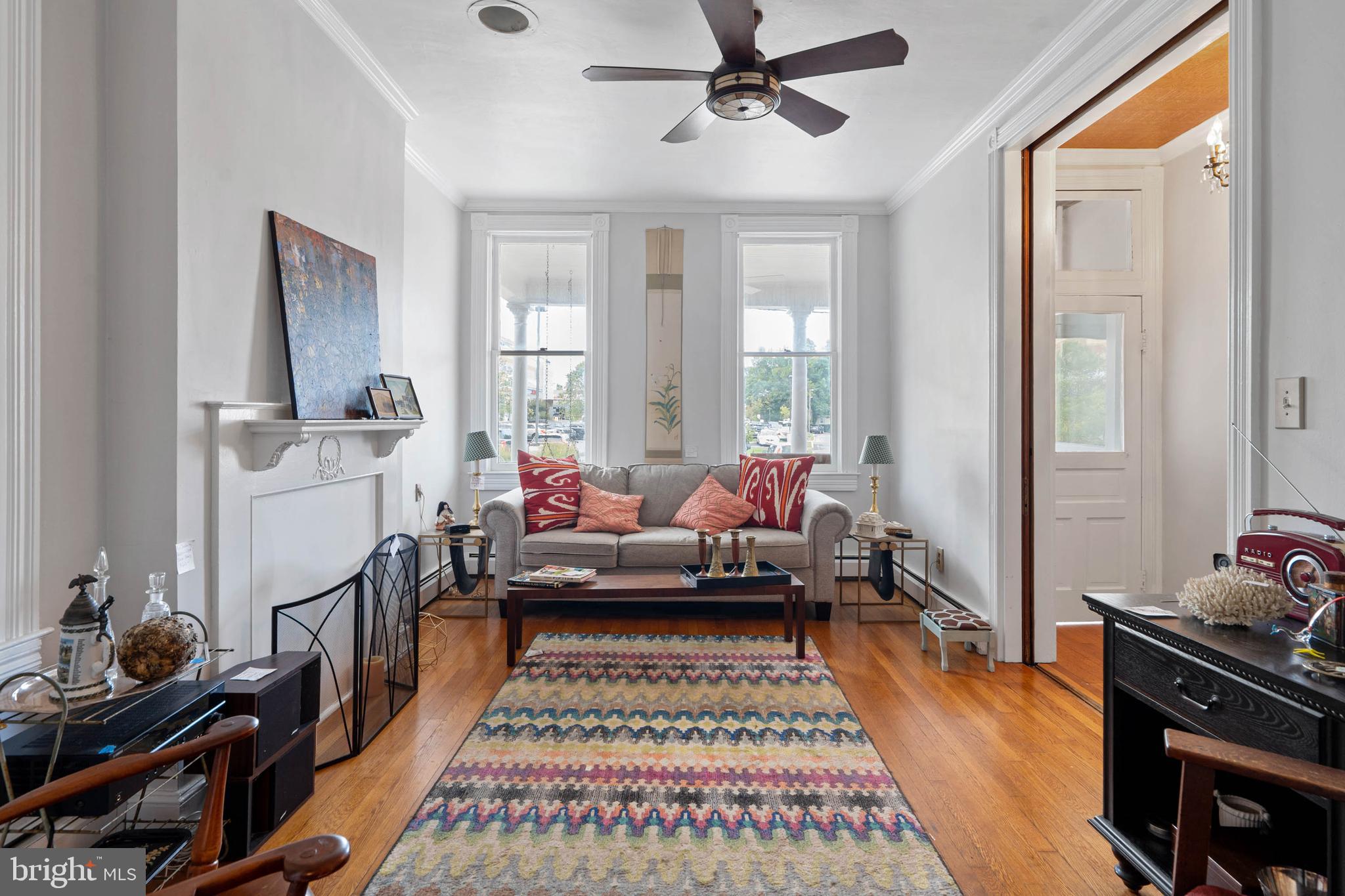 407 Savannah Road Lewes, DE 19958 - Photo 7 of 28 a living room with furniture and a rug