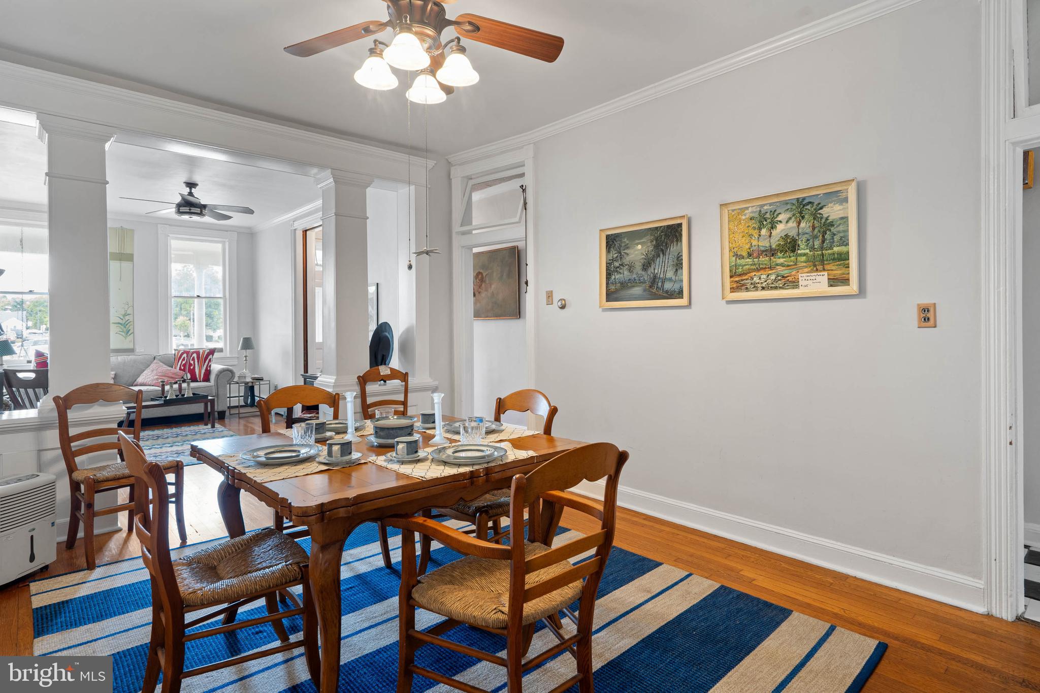 407 Savannah Road Lewes, DE 19958 - Photo 8 of 28 a view of a dining room with furniture and wooden floor