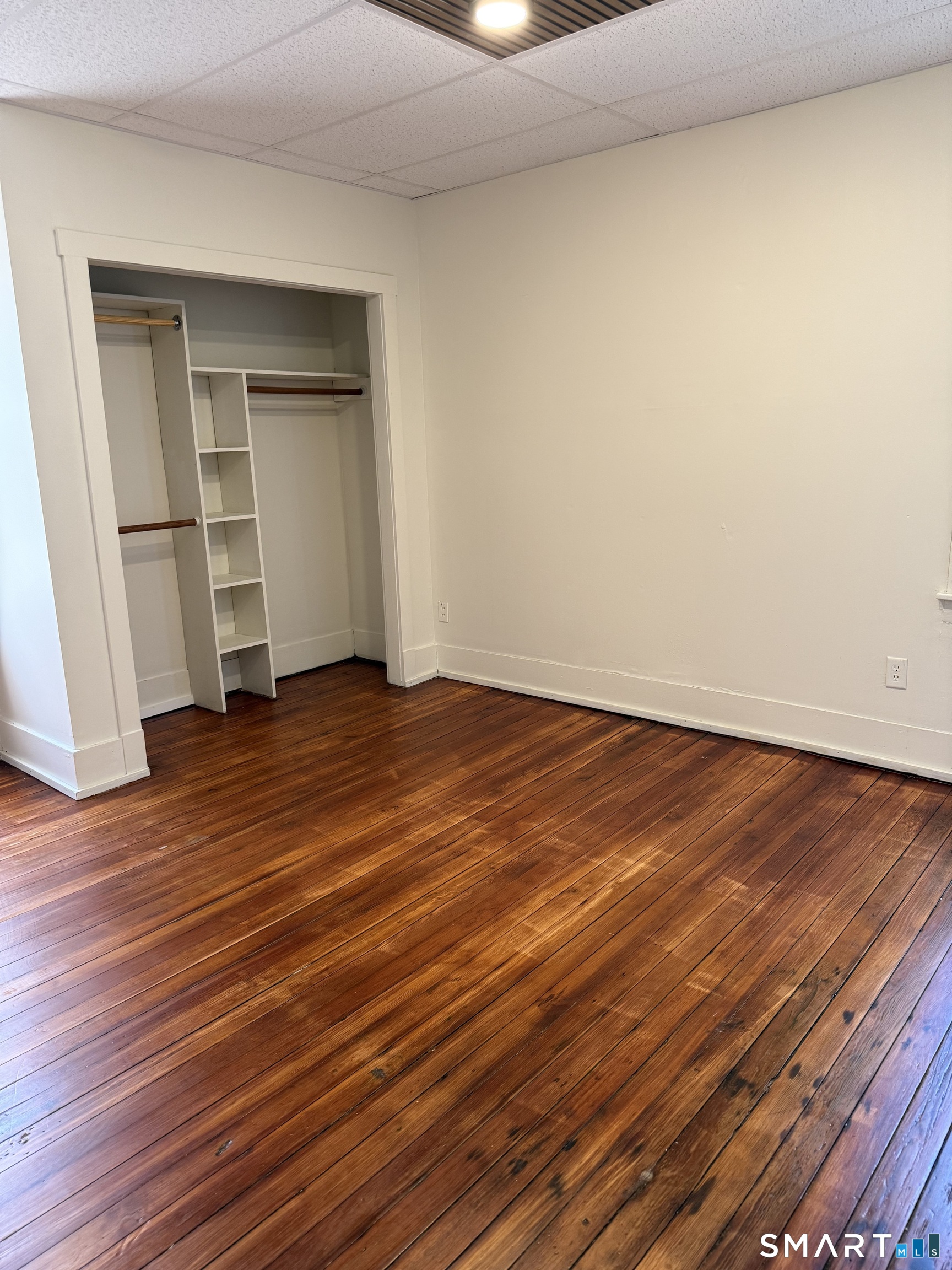 38 Read Street New Haven, CT 06511 - Photo 6 of 10 a view of a room with wooden floor and closet
