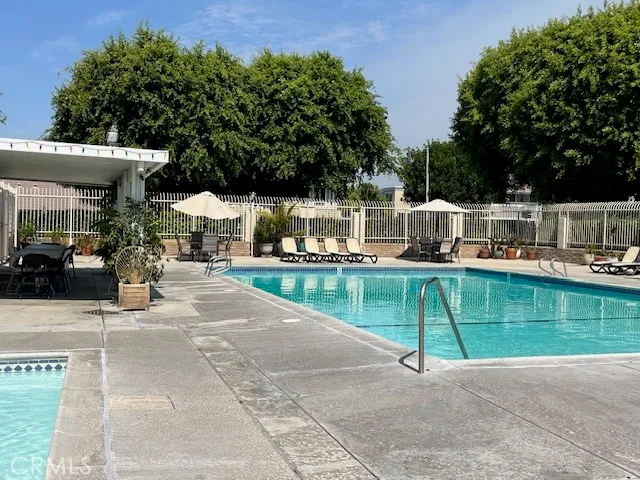 a view of a swimming pool with a patio
