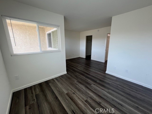 45 Golden Glen Street, Unit 75 Irvine, CA 92604 - Photo 22 of 35 a view of an empty room with wooden floor and a window