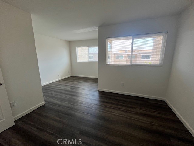 45 Golden Glen Street, Unit 75 Irvine, CA 92604 - Photo 25 of 35 an empty room with wooden floor and windows