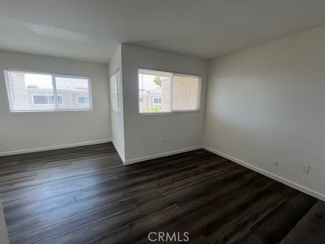 45 Golden Glen Street, Unit 75 Irvine, CA 92604 - Photo 26 of 35 an empty room with wooden floor and windows
