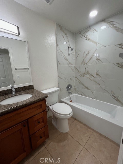 45 Golden Glen Street, Unit 75 Irvine, CA 92604 - Photo 30 of 35 a bathroom with a granite countertop toilet a sink and bathtub