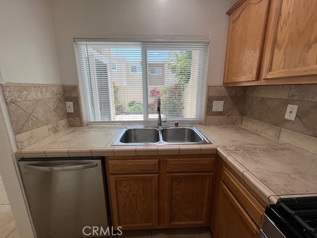 45 Golden Glen Street, Unit 75 Irvine, CA 92604 - Photo 5 of 35 a kitchen with a sink and cabinets