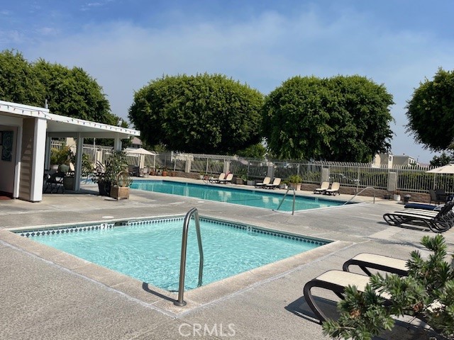 45 Golden Glen Street, Unit 75 Irvine, CA 92604 - Photo 6 of 35 a view of a swimming pool with a patio