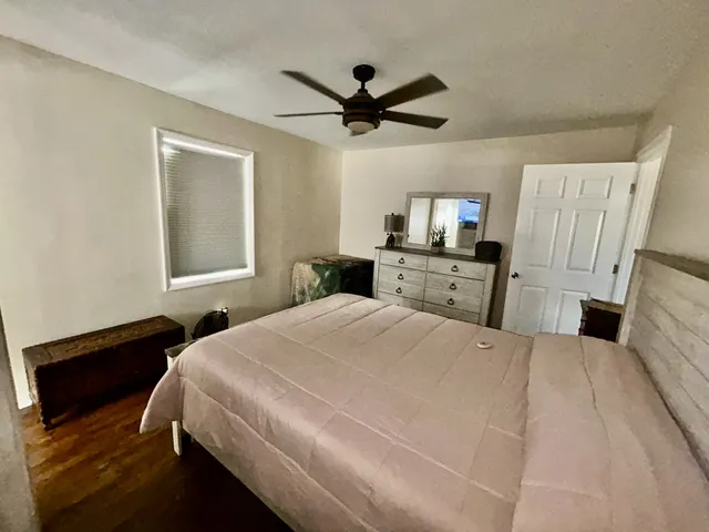 a bedroom with a bed and window
