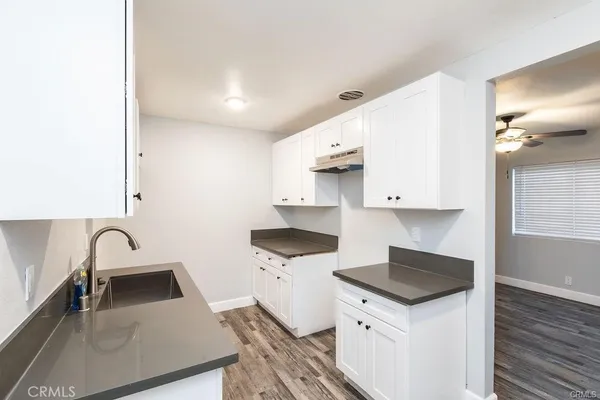 a kitchen with stainless steel appliances a sink a stove and a refrigerator