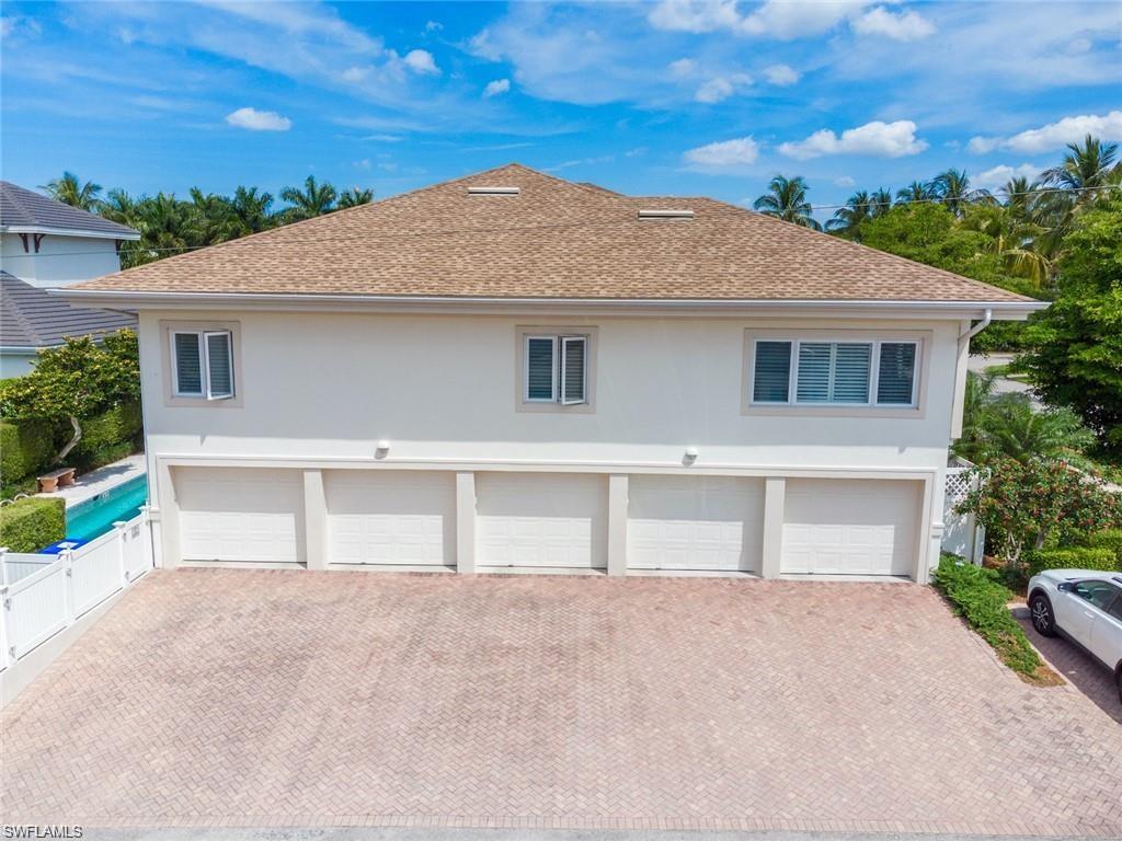 210 2nd Street South, Unit 1C Naples, FL 34102 - Photo 22 of 28 front view of house with a yard
