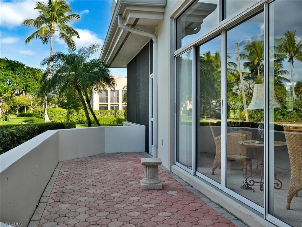 210 2nd Street South, Unit 1C Naples, FL 34102 - Photo 24 of 28 a view of a porch with a potted plant