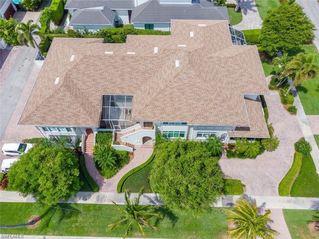 210 2nd Street South, Unit 1C Naples, FL 34102 - Photo 27 of 28 an aerial view of a house with a yard and potted plants