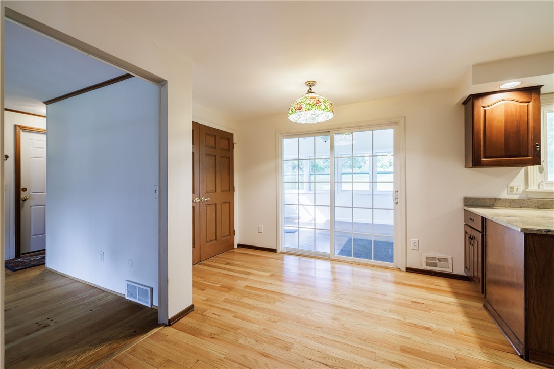 37 Heatherwood Road Perinton, NY 14450 - Photo 5 of 42 Eat in kitchen area with sliding doors leading to 3 season room