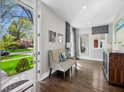 a living room with furniture and a garden