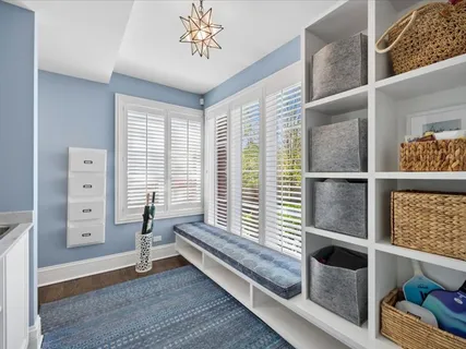 a spacious bedroom with a bed couch and a large window
