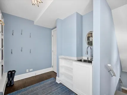 a spacious bathroom with a sink double vanity granite and a mirror
