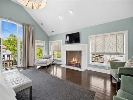 a spacious bedroom with a bed and a couch