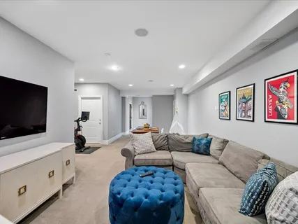a living room with patio furniture and garden