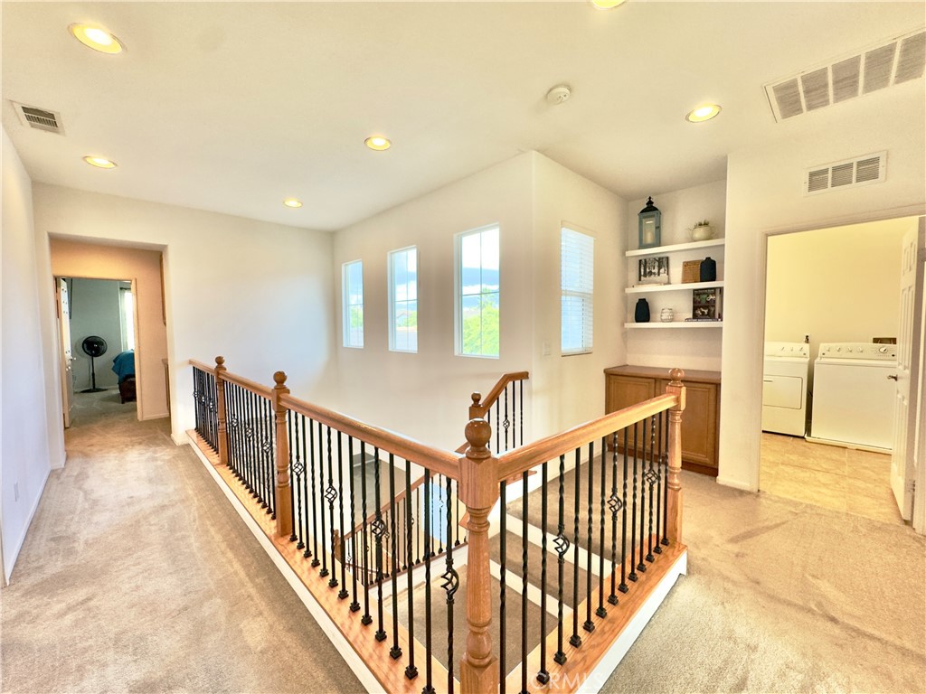 11265 Runyan Road Beaumont, CA 92223 - Photo 53 of 138 a view of a hallway with bedroom and windows
