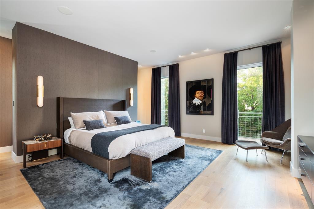 9435 Inwood Road Dallas, TX 75220 - Photo 21 of 37 a bedroom with a large bed and a large window