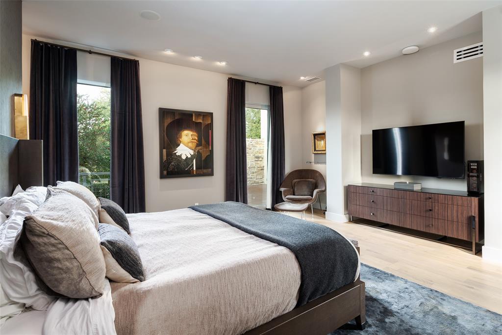 9435 Inwood Road Dallas, TX 75220 - Photo 22 of 37 a bedroom with a bed and a flat screen tv