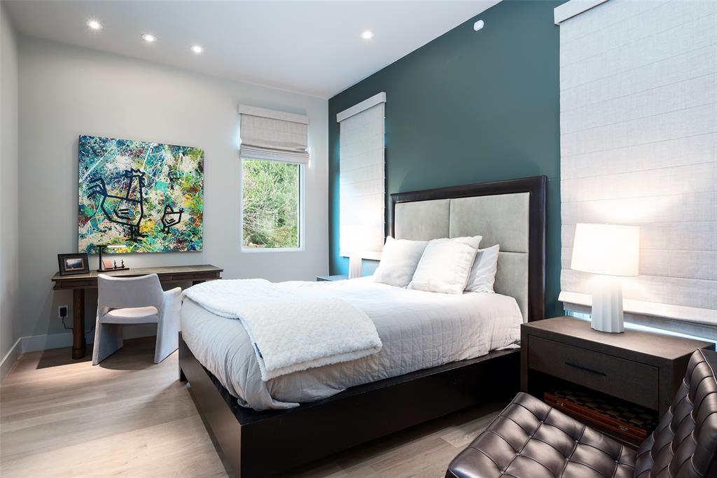 9435 Inwood Road Dallas, TX 75220 - Photo 26 of 37 a large bed sitting in a bedroom next to a window