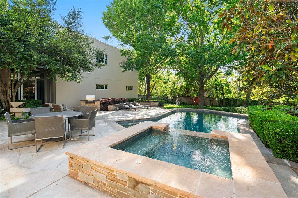 9435 Inwood Road Dallas, TX 75220 - Photo 32 of 37 a view of a swimming pool with chairs