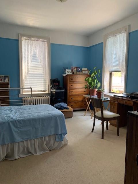 255 79th Street, Unit E8 Brooklyn, NY 11209 - Photo 7 of 9 a bedroom with a bed chair and window