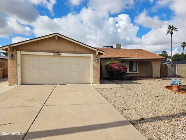 a front view of a house with a garage