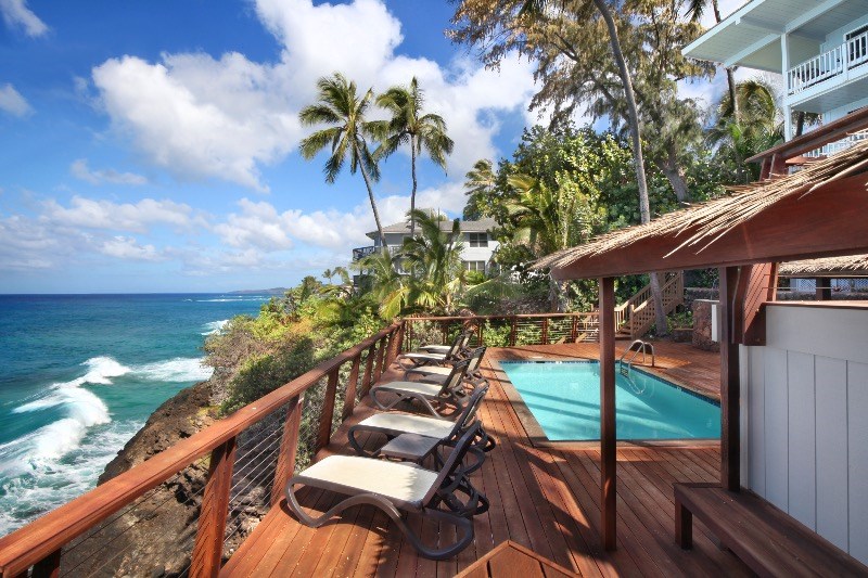 1697 Pe'e Road, Unit 104 Koloa, HI 96756 - Photo 15 of 17 a view of a backyard with sitting area