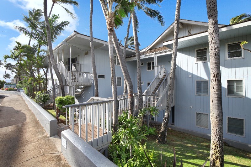 1697 Pe'e Road, Unit 104 Koloa, HI 96756 - Photo 17 of 17 a house with lots of trees in front of it
