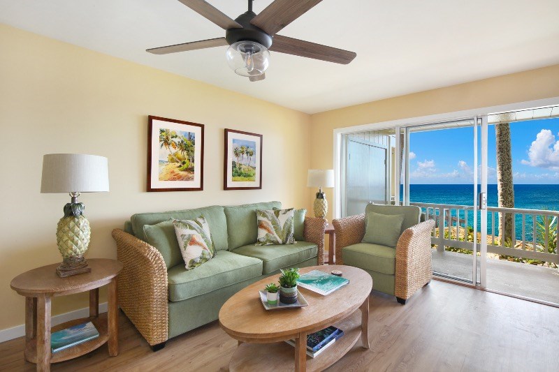 1697 Pe'e Road, Unit 104 Koloa, HI 96756 - Photo 5 of 17 a living room with furniture and a table