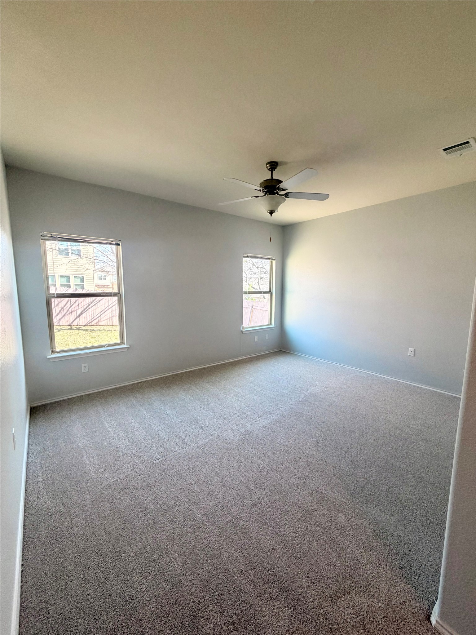 10204 Pinnacle Crest Loop Austin, TX 78747 - Photo 14 of 17 featuring a ceiling fan and New carpet