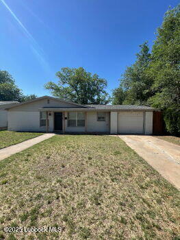 4315 41st Street Lubbock, TX 79413 - Photo 1 of 14 a front view of a house with a yard