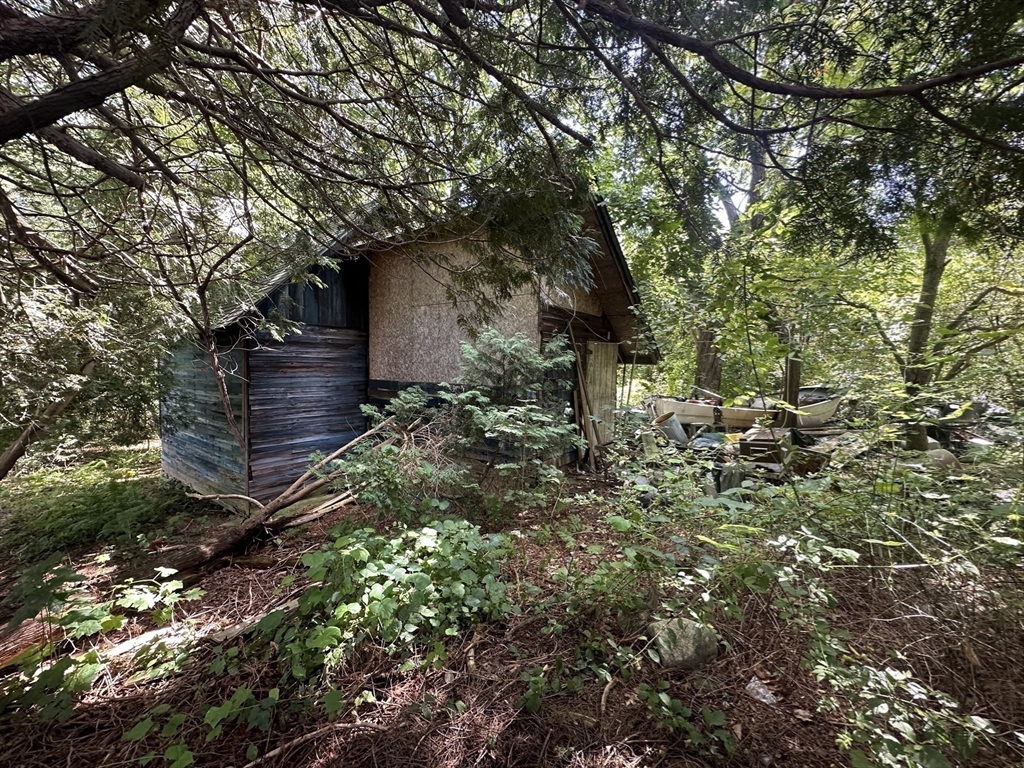 44 Federal Street Blackstone, MA 01504 - Photo 14 of 20 a backyard of a house with lots of green space