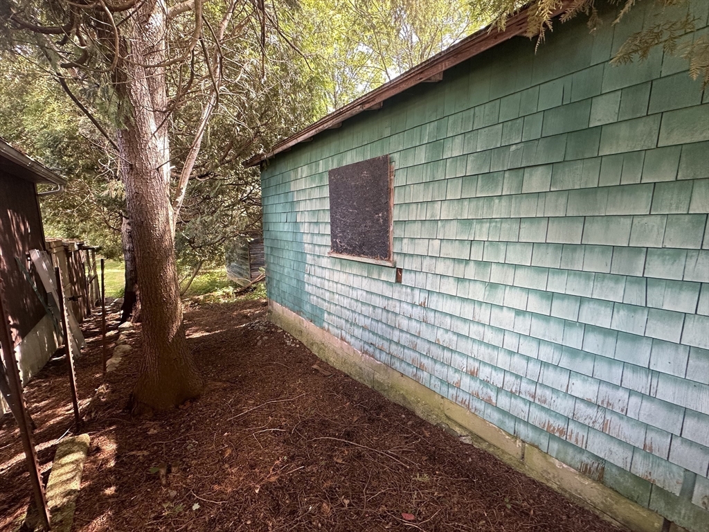 44 Federal Street Blackstone, MA 01504 - Photo 8 of 20 a backyard of a house with lots of green space