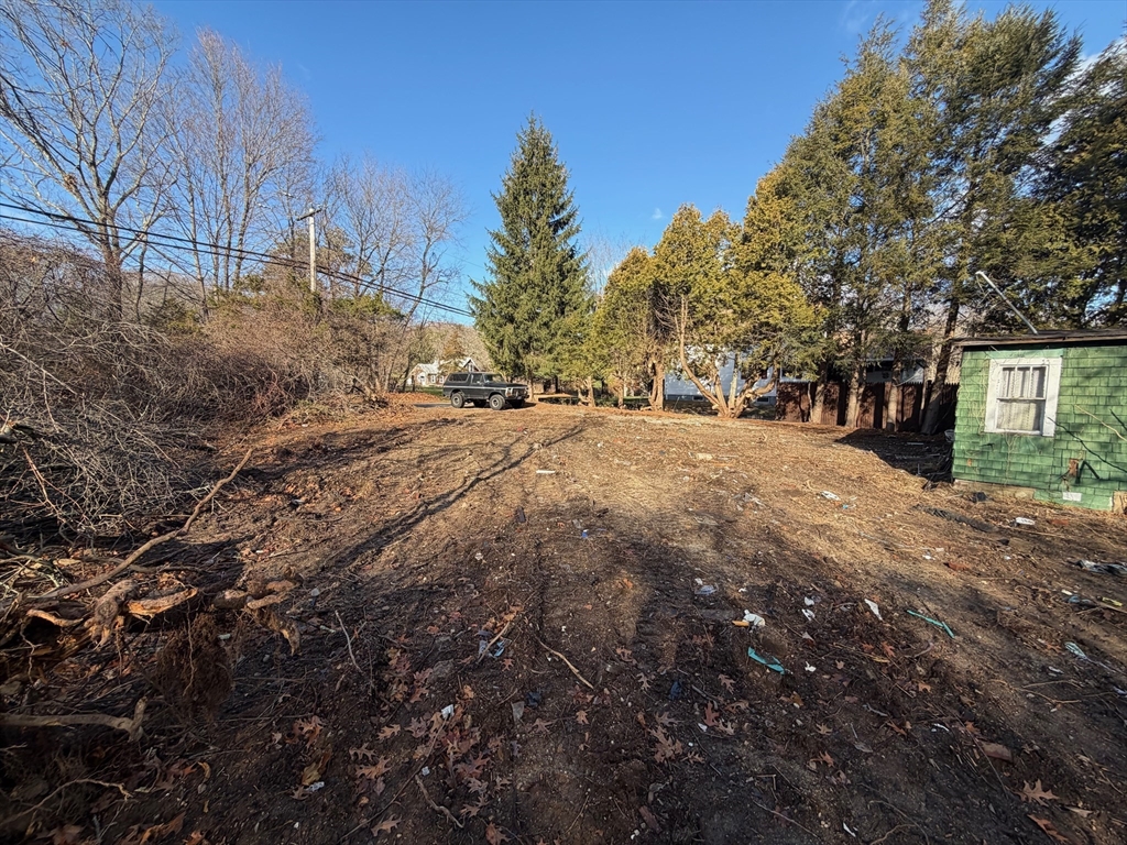 44 Federal Street Blackstone, MA 01504 - Photo 9 of 20 a backyard of a house with large trees