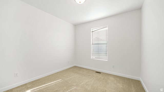 6017 North Sheps Road, Unit C211 Eagle Mountain, UT 84005 - Photo 15 of 25 Neutral wall finish, carpeted flooring, window with horizontal blinds, and a flush mount ceiling light fixture
