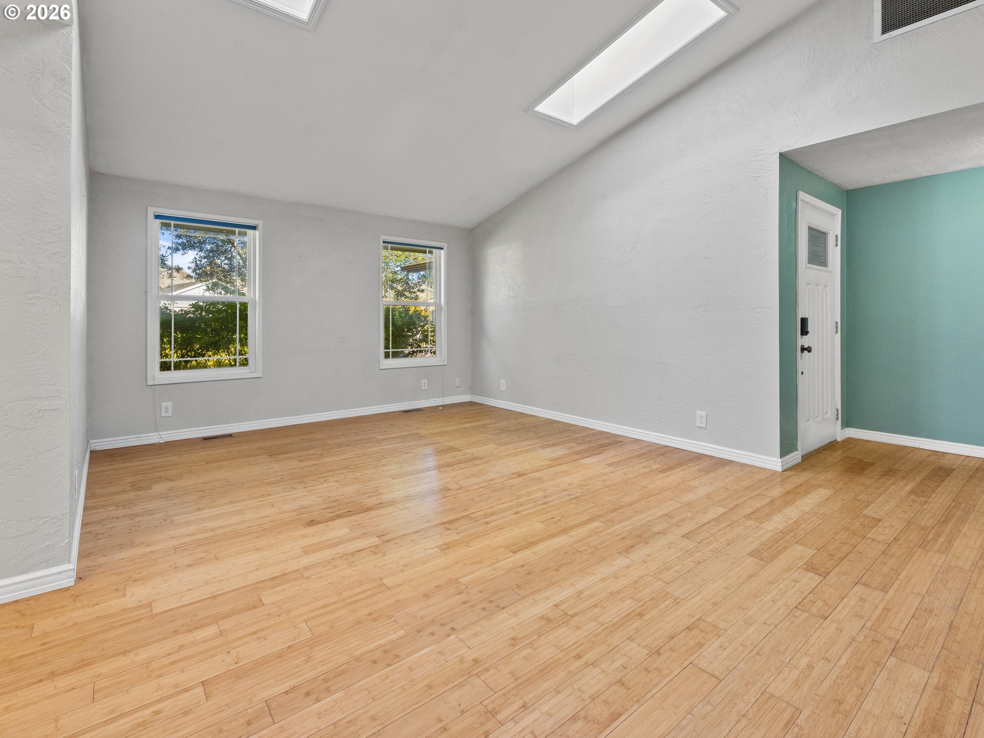 2066 40th Street Florence, OR 97439 - Photo 12 of 48 a view of empty room with wooden floor and fan