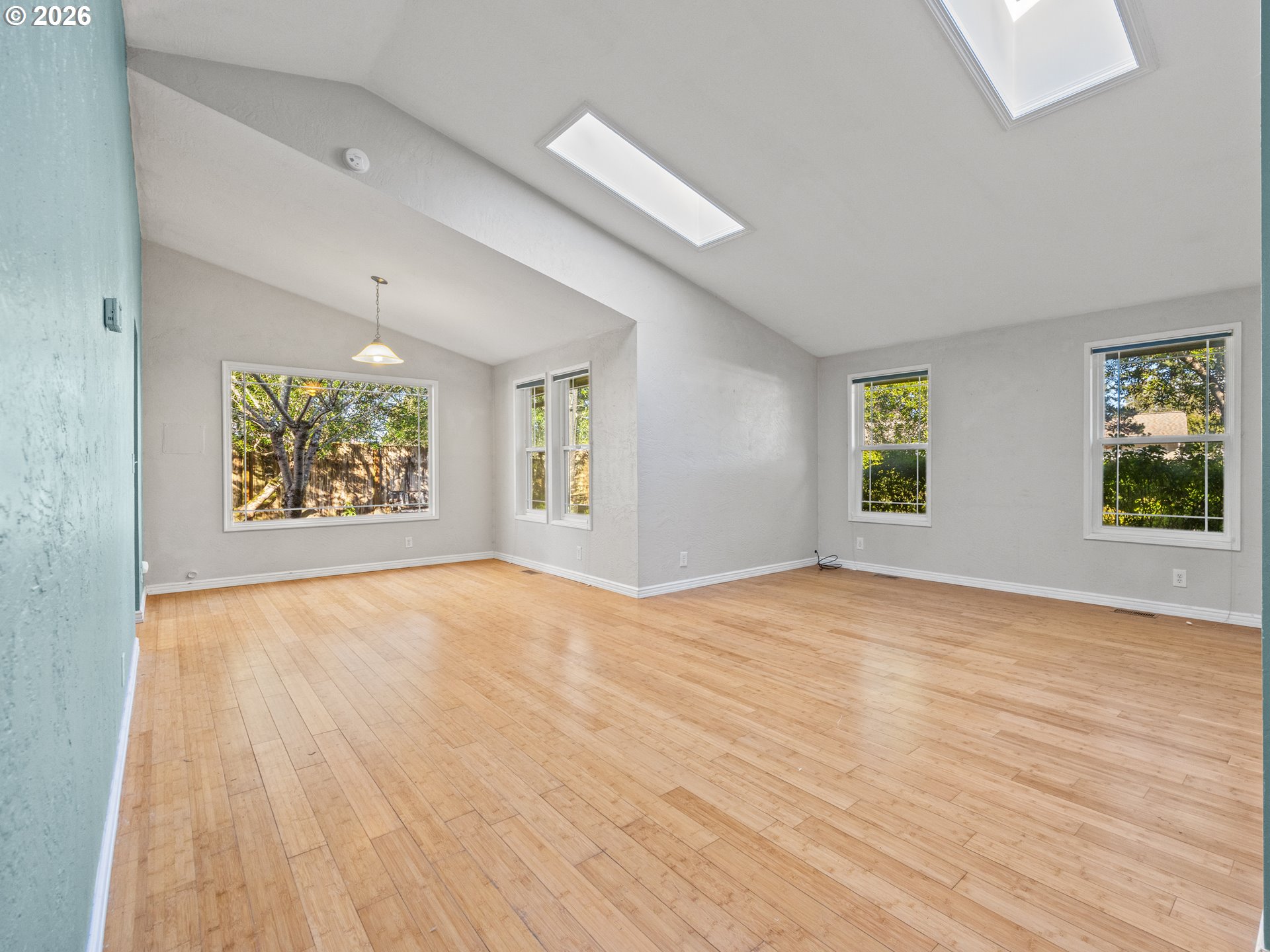 2066 40th Street Florence, OR 97439 - Photo 2 of 48 an empty room with wooden floor and windows