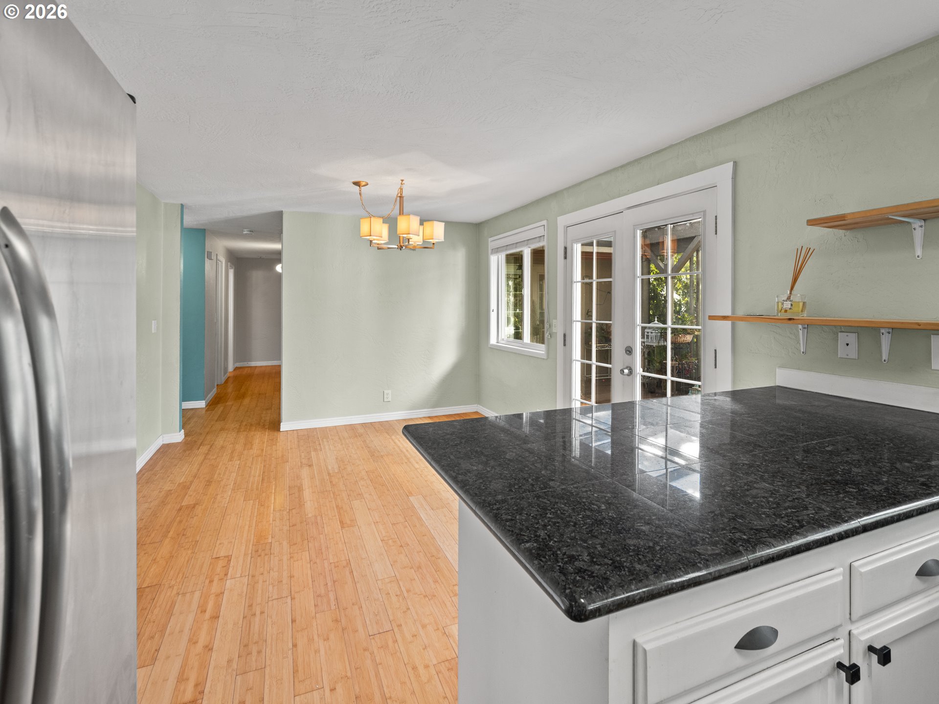 2066 40th Street Florence, OR 97439 - Photo 22 of 48 a kitchen with kitchen island a counter top space and a sink