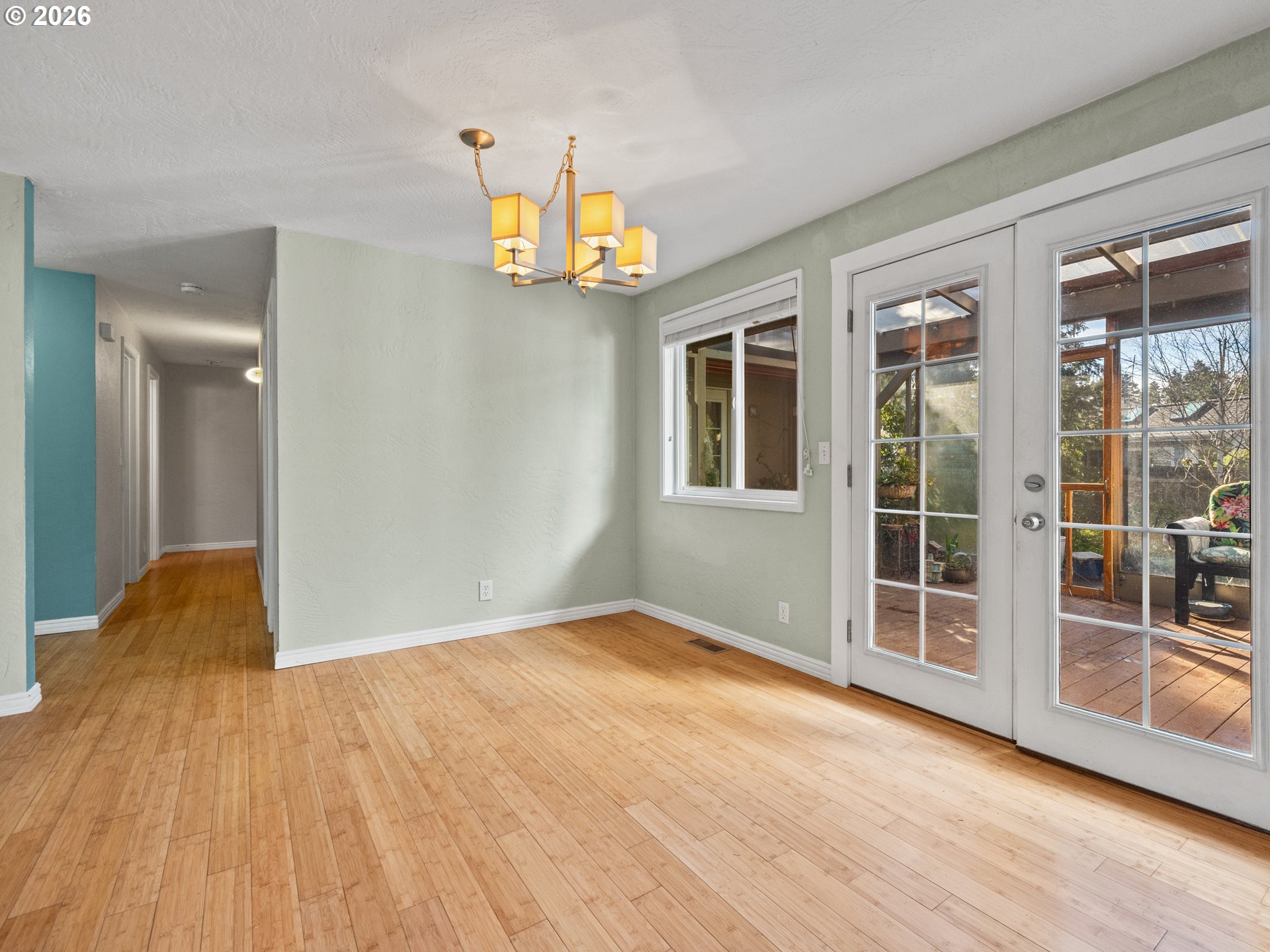2066 40th Street Florence, OR 97439 - Photo 24 of 48 wooden floor in an empty room with a window