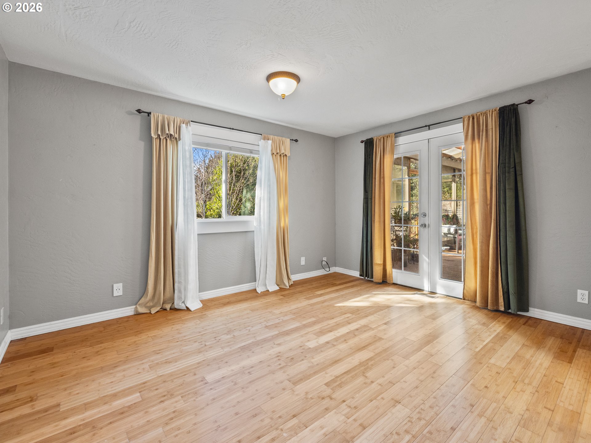 2066 40th Street Florence, OR 97439 - Photo 28 of 48 a view of an empty room with wooden floor and a window