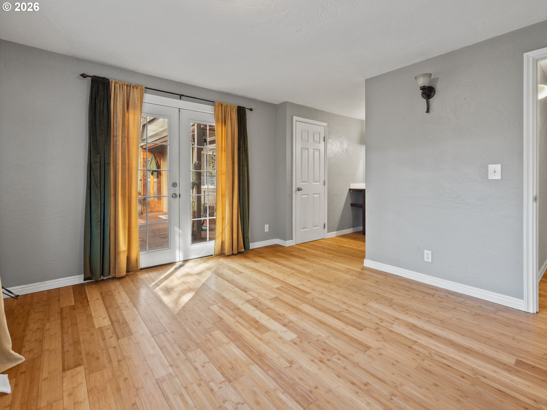 2066 40th Street Florence, OR 97439 - Photo 29 of 48 a view of an empty room with wooden floor and a window