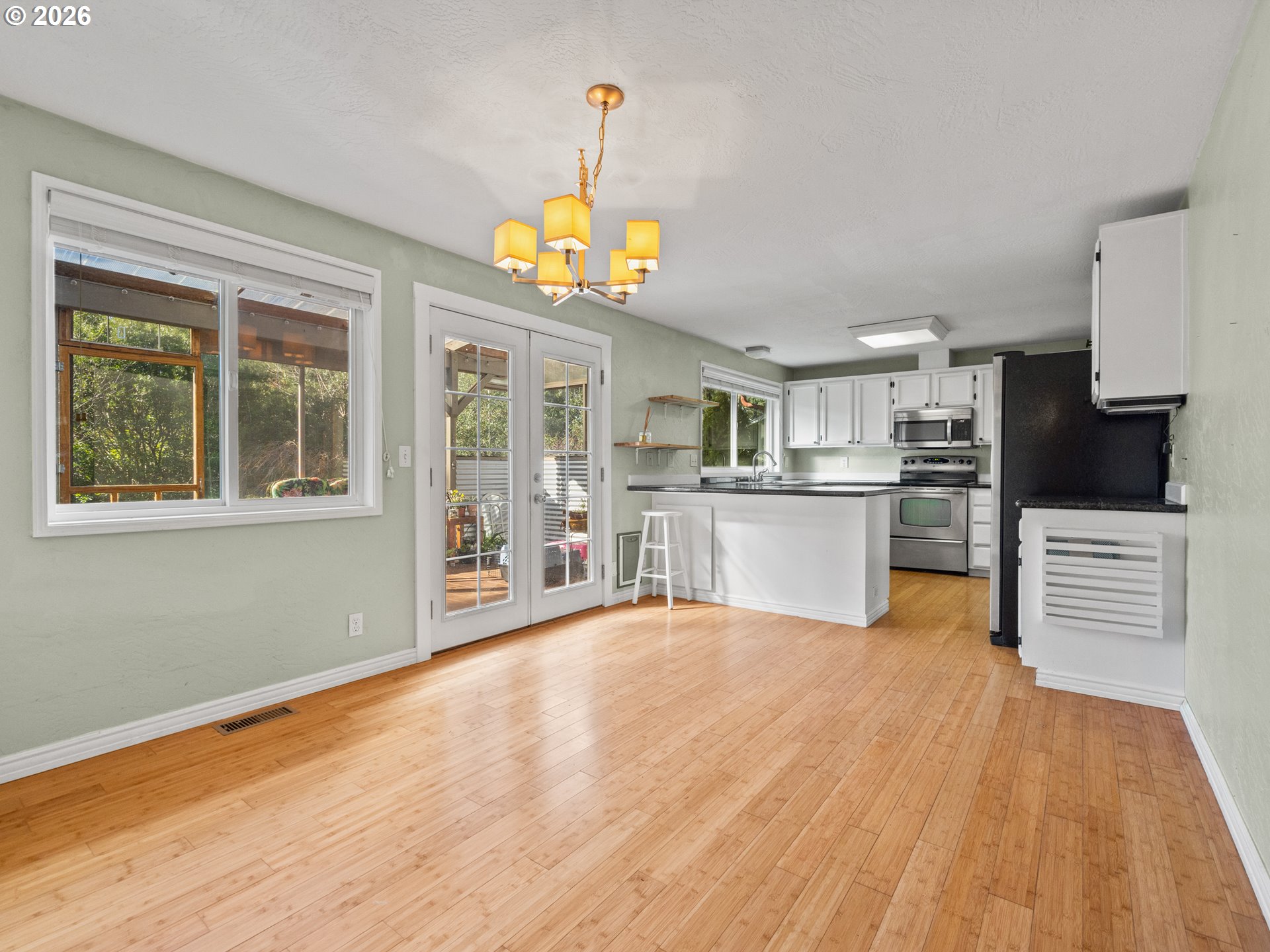 2066 40th Street Florence, OR 97439 - Photo 3 of 48 a view of a kitchen with microwave and stove