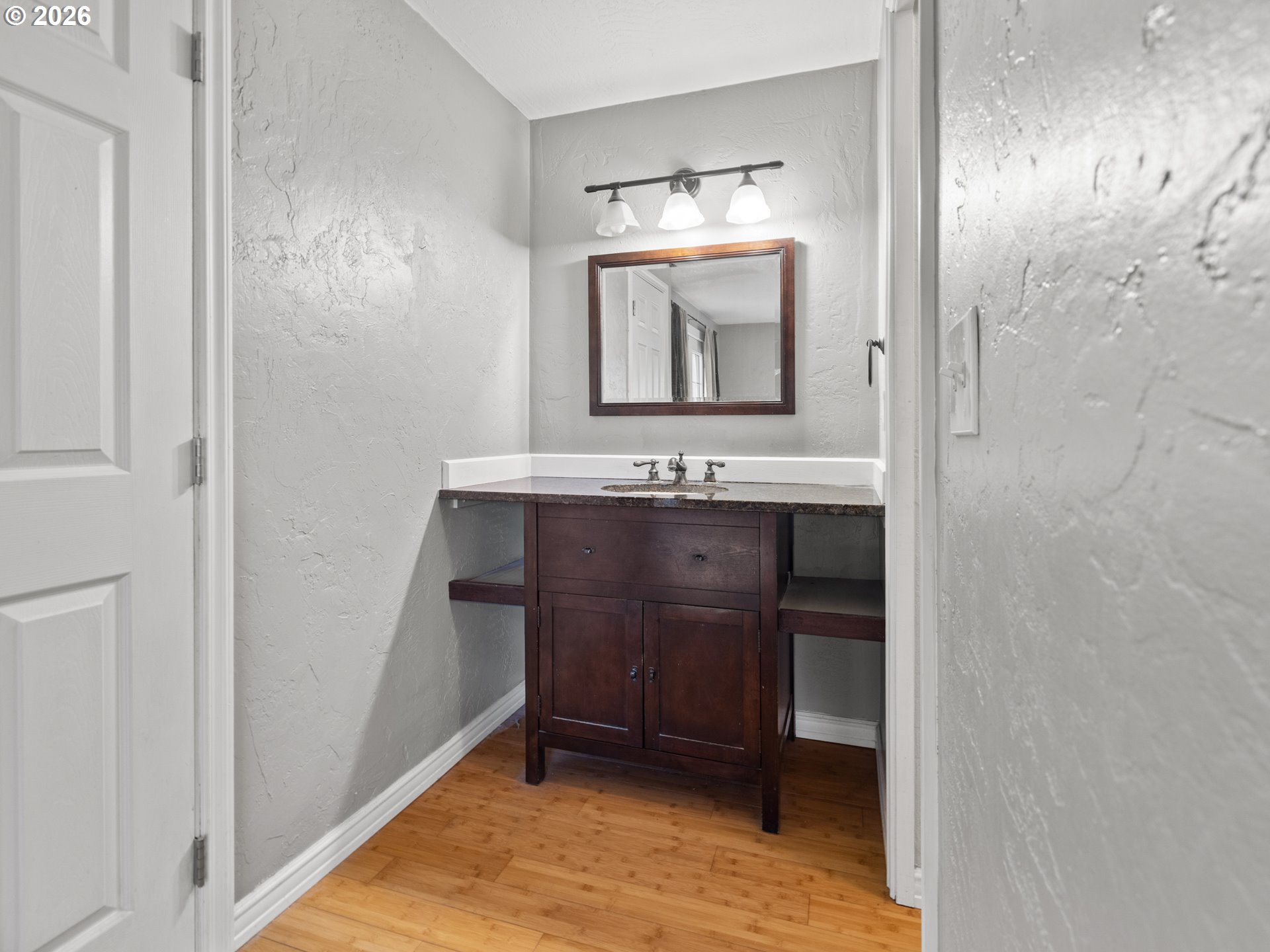 2066 40th Street Florence, OR 97439 - Photo 33 of 48 a bathroom with a sink and a mirror