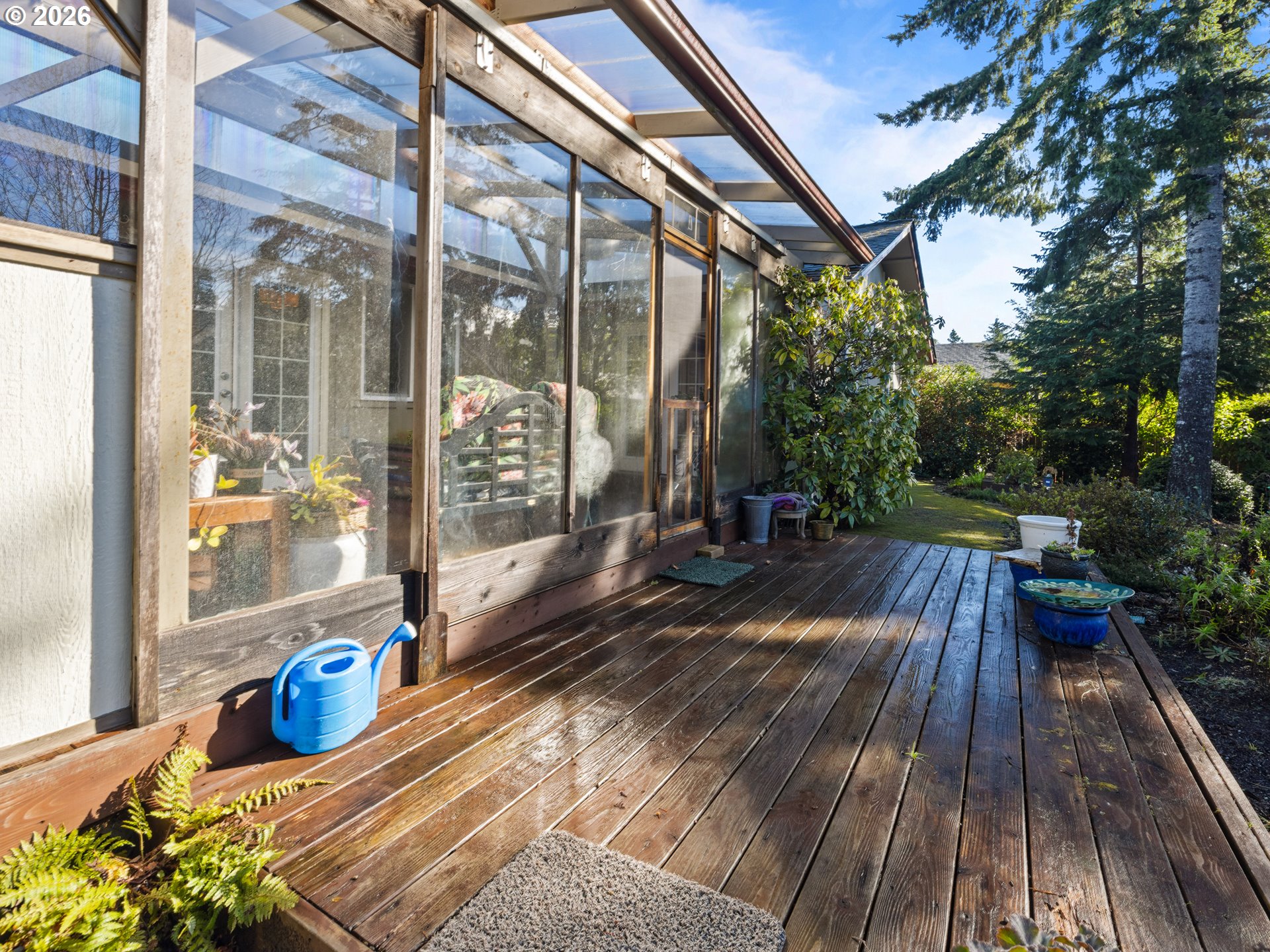 2066 40th Street Florence, OR 97439 - Photo 4 of 48 a view of a balcony with wooden floor and outdoor seating