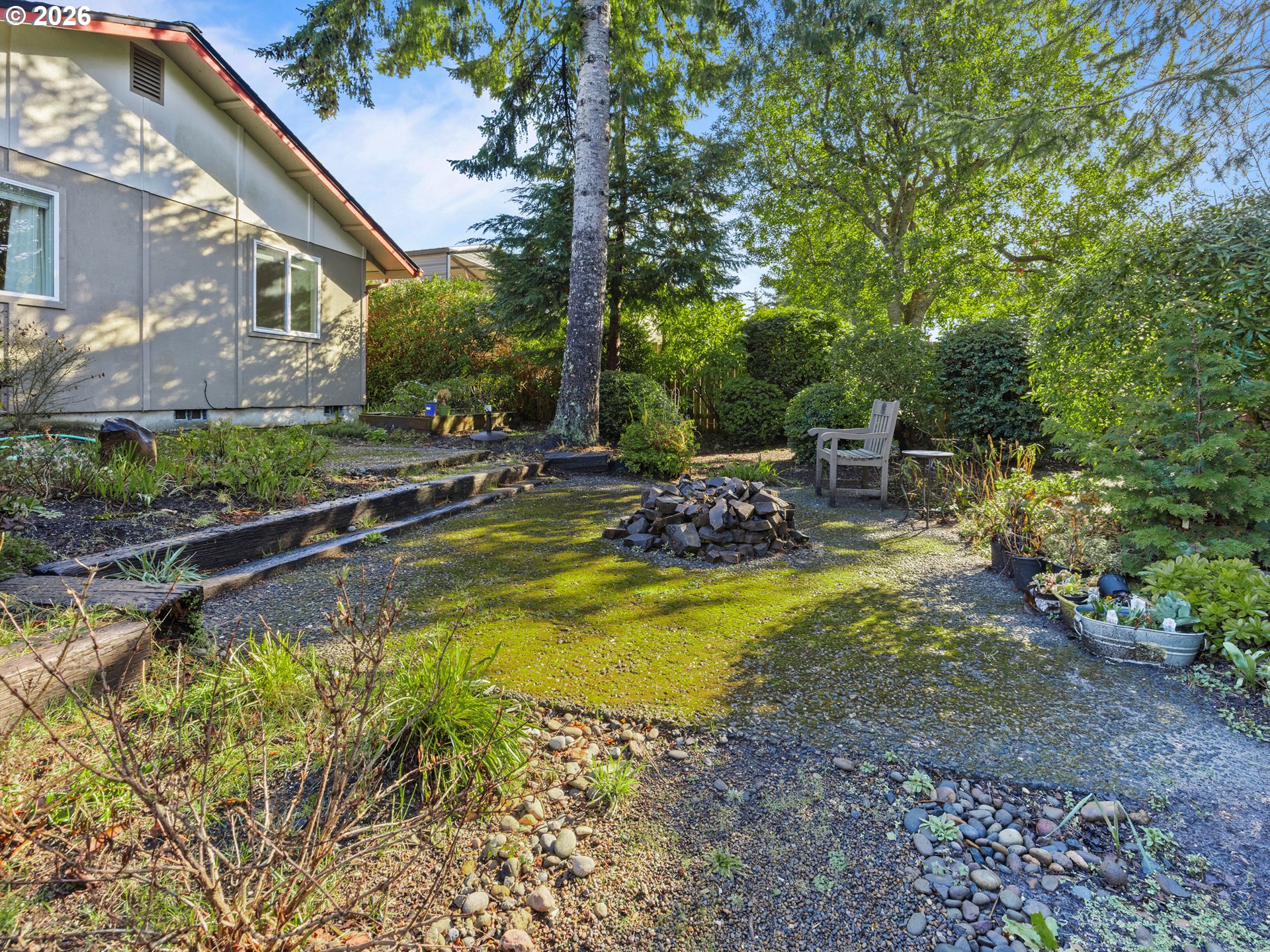 2066 40th Street Florence, OR 97439 - Photo 46 of 48 a view of swimming pool with lawn chairs and plants