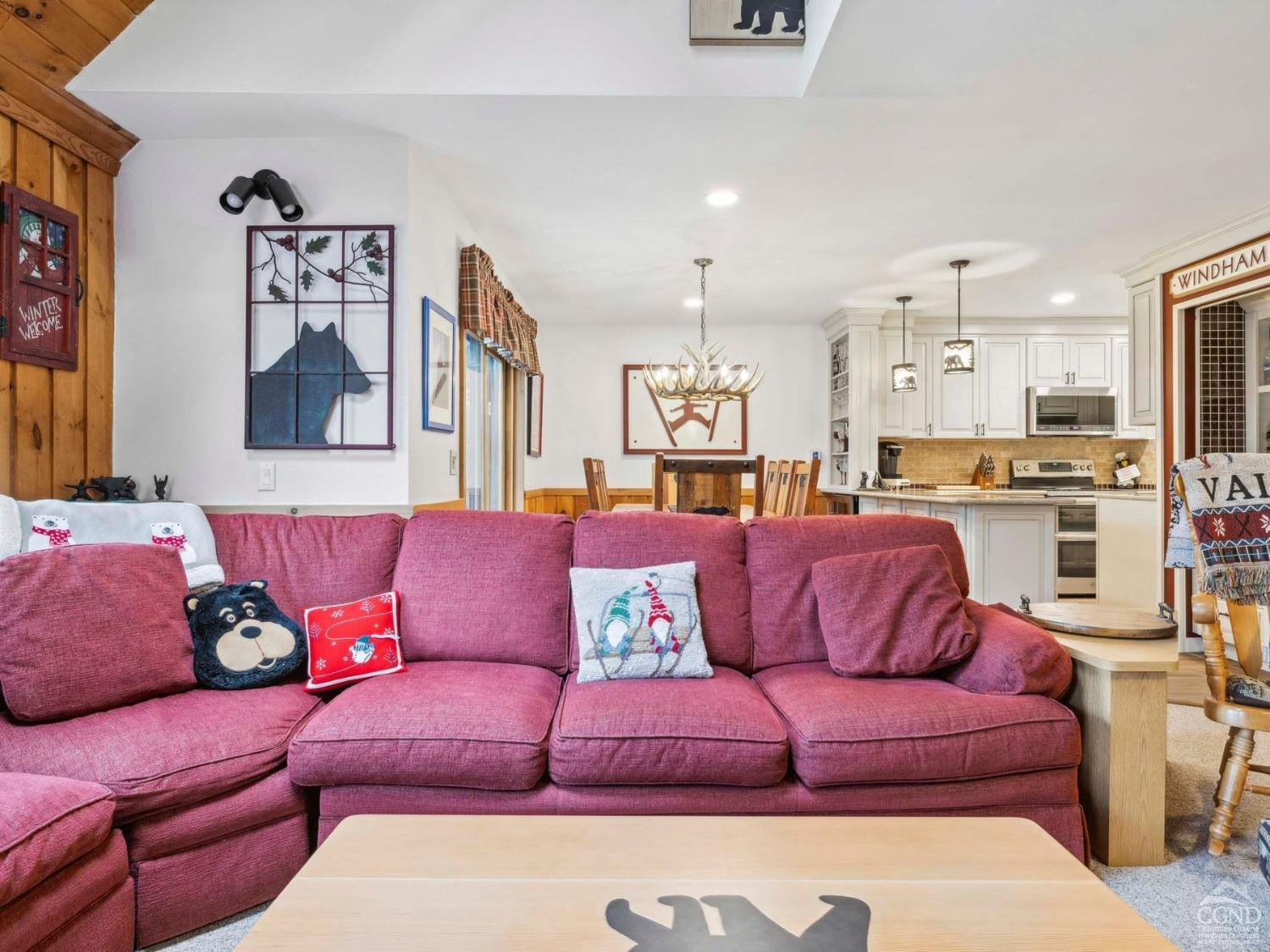 57 Brainard Ridge Road, Unit 3E Windham, NY 12496 - Photo 11 of 55 a living room with furniture and kitchen view